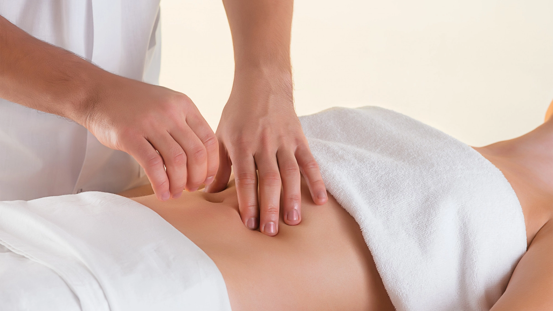 Relaxed woman enjoying a lymphatic drainage massage in a tranquil spa environment.