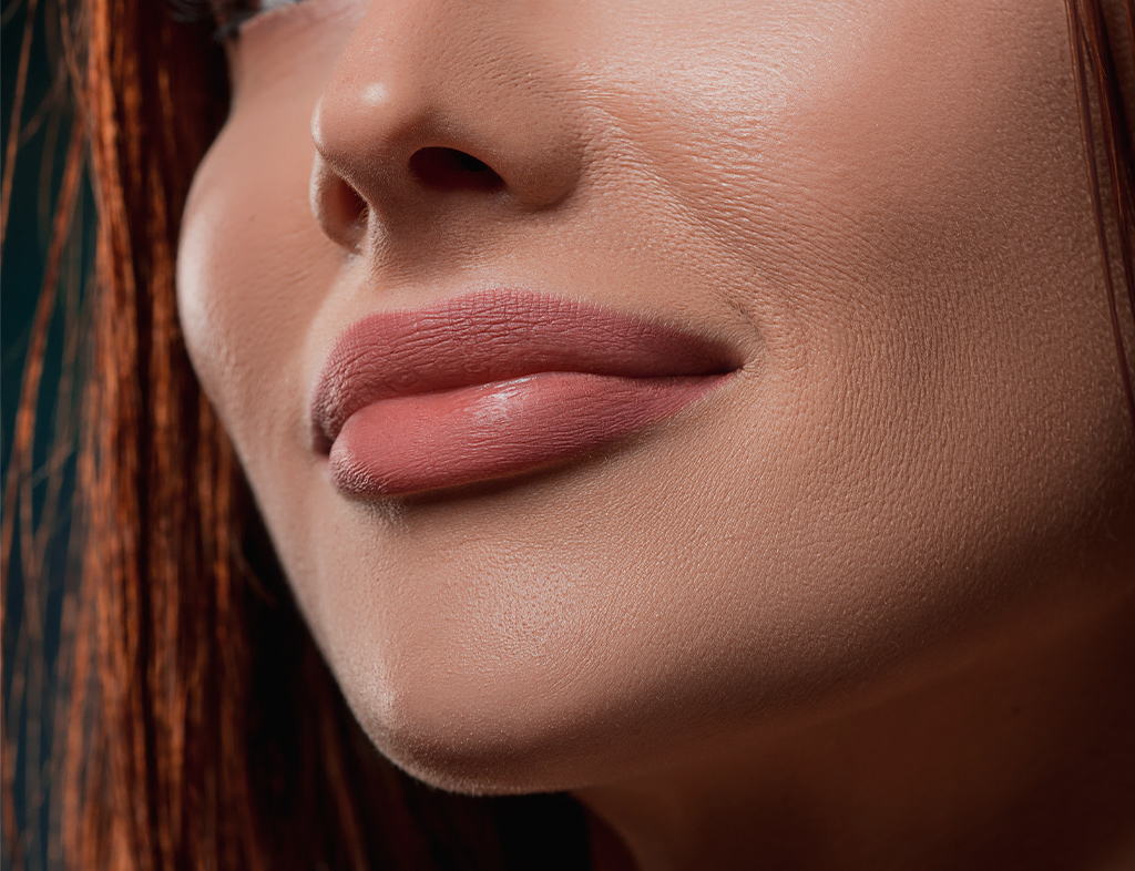 Close-up of plump, fuller lips after lip filler treatment at Akasha Wellness & Spa.